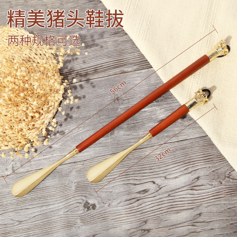 Fábrica en stock Zodiaco cabeza de cerdo de metal zapato extractor conveniente zapato dispositivo de elevación bomba de zapatos