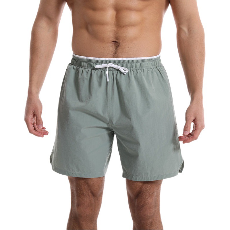 Pantalones cortos deportivos casuales de color sólido para hombres pantalones cortos de verano sueltos de secado rápido transpirable baloncesto americano ropa de entrenamiento de fitness