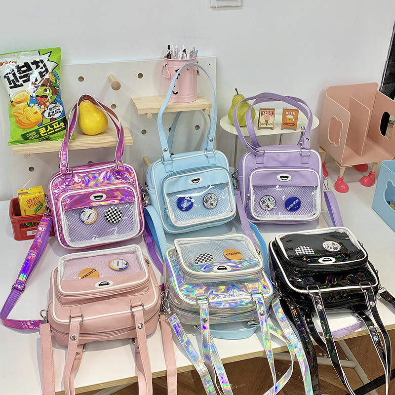 Paquete de dolor de comida de dos dimensiones japonesa 2025 nuevo paquete de hombro transparente para niños y niñas bolsas animadas de moda para niños