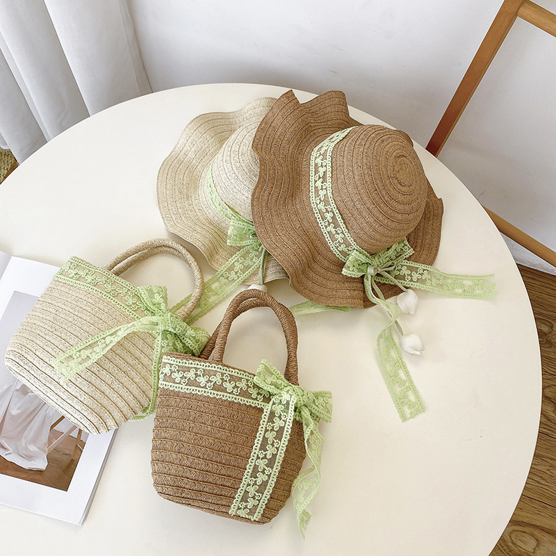 Nicho popular estilo coreano tulipán arco de papilla para niñas sombrero de paja paquete de bolsas pequeñas frescas dulces gorras de protección solar