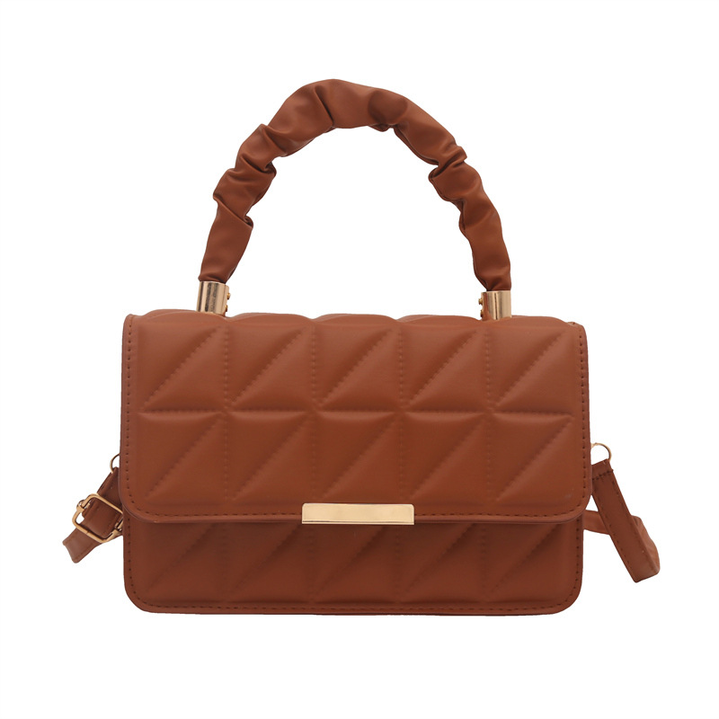 Minimalista bolso de viaje de viento 2024 engolpeado diamante otoño nuevo diseño de bolso de hombro simple estilo bolso de mochila