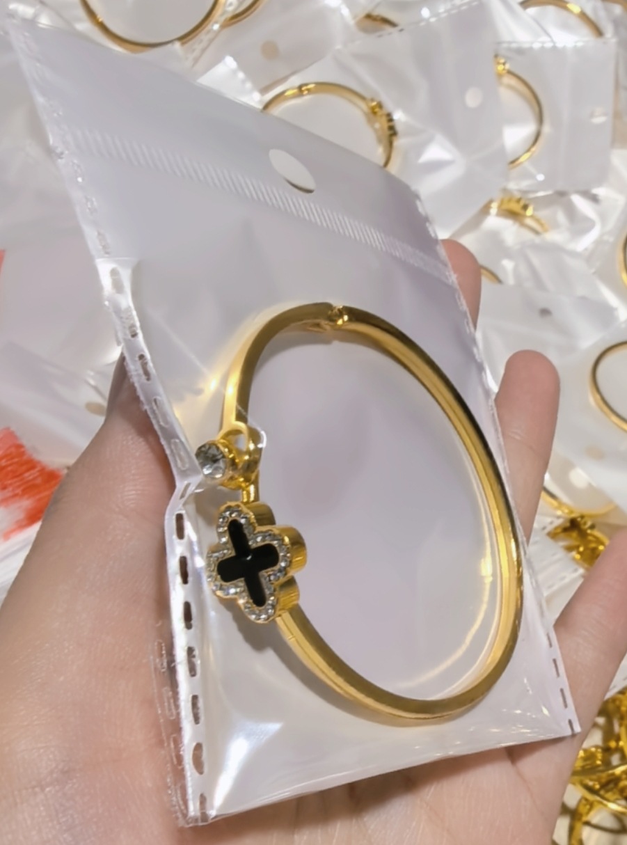 Four-leaf clover gold black cross