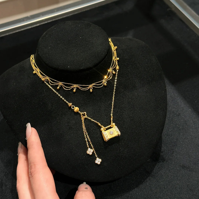 古法沙金工芸国潮風に四葉草の長い命の鎖のネックレスの復古の花の糸を入れてデザインしてペンダントの女性を包みます。|undefined
