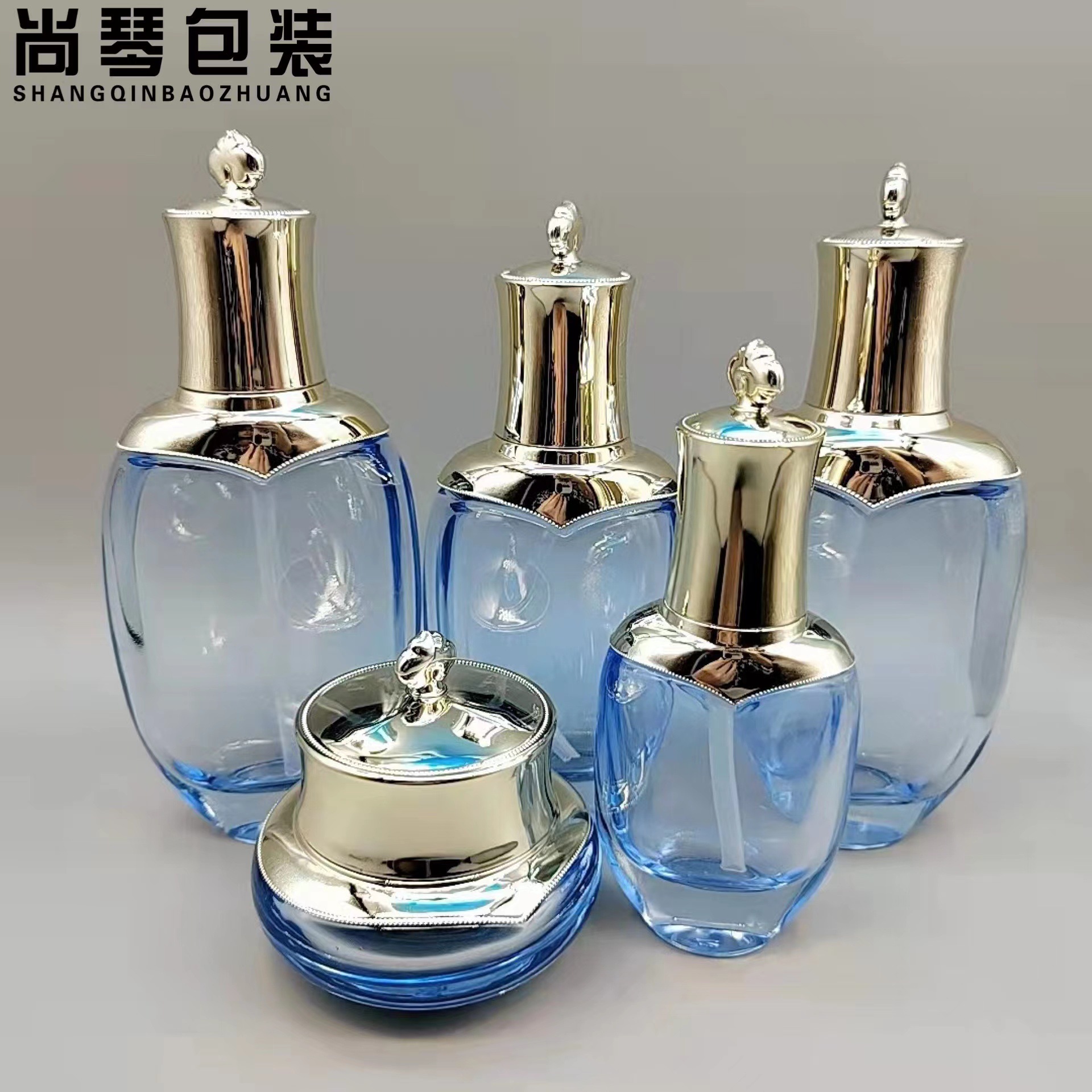 Fábrica en stock suministro de clima Dan mismo estilo conjunto botella de esencia botella de loción botella de pasta de dama botella de vidrio cosmético