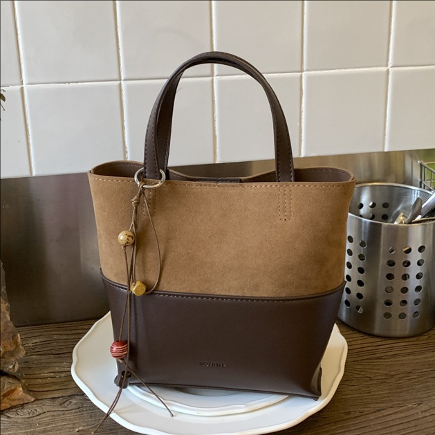 Bolso de moda transfronteriza retro bolso de cubo de agua mujer otoño y invierno 2025 nuevo estilo versátil bolso de hombro de viaje