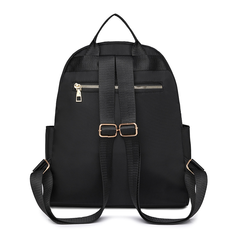 Comercio exterior al por mayor 2024 nuevo estilo casual señoras Lingge mochila moda remache color contraste mochila ligera mochila escolar marea