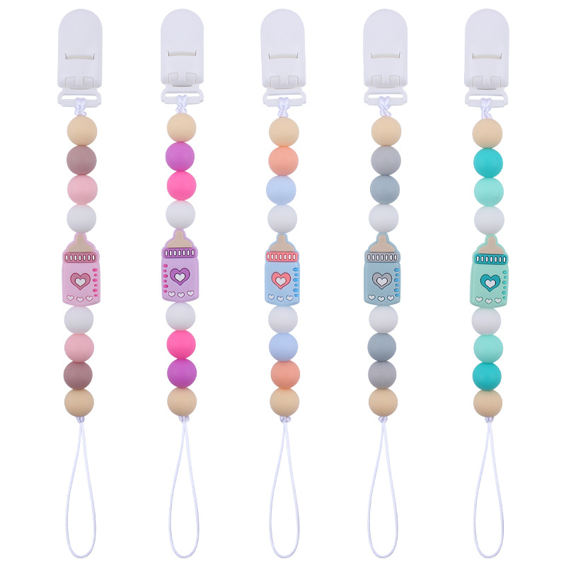 Nuevos suministros de bebé biberón de dibujos animados pequeño mordedor calmante bebé DIY cuentas de silicona mordedura molar Cadena de pezón