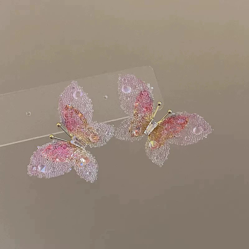 2026 viento falso sensación de atmósfera super inmortal pendientes de flores de malla temperamento suave de chiffon para mujeres pendientes