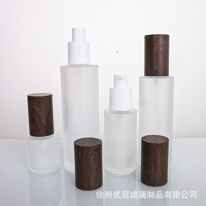 Botella de cosméticos de madera oscura botella de crema de vidrio gruesa botella de emulsión sellada botella de crema frita botella vacía