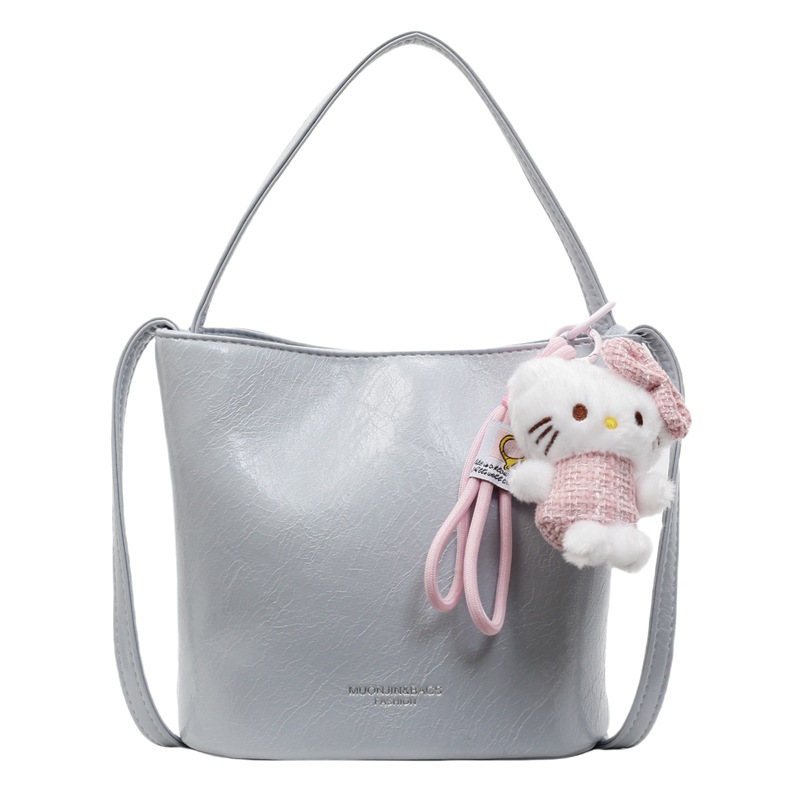 Bolso de cubo de viajero de gran capacidad simple de moda de moda para mujer 2025 nuevo bolso de mensajero de hombro casual de color sólido popular