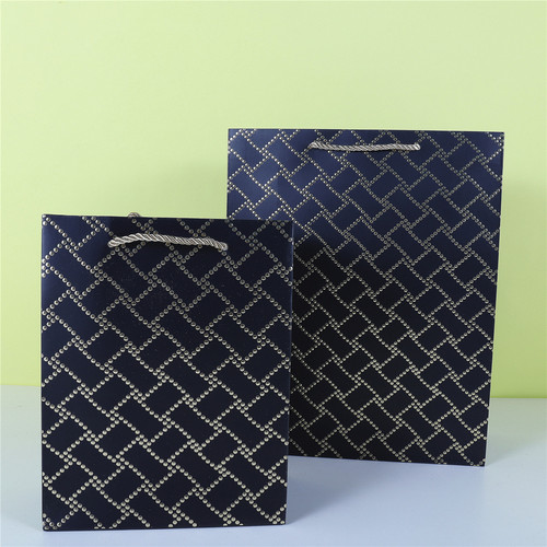 Threaded hot stamping white card gift bag irregular connection hot stamping platinum paper bag clothing shopping bag wholesale