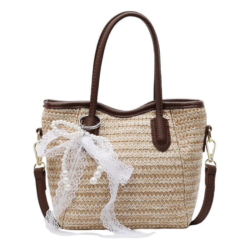 Bolso de cubo portátil de paja de gran capacidad de tendencia para mujer 2025 nuevo bolso de mensajero de hombro de moda de viaje de vacaciones en la playa