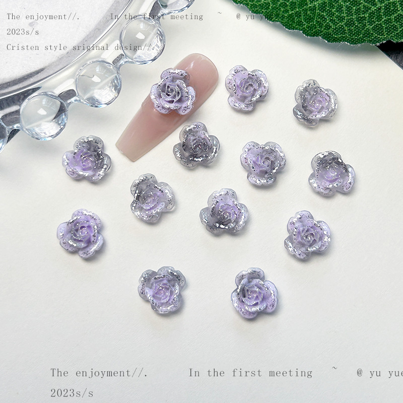 Nueva joyería de uñas de estilo gris-púrpura salvaje de estilo ins mezclada luminosa tridimensional de flores pequeñas accesorios de armadura al por mayor