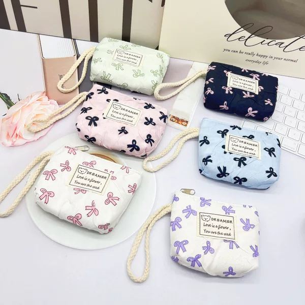 New cross-border bow-knot coin purse with wrist strap, mini portable coin bag, cute hand-held small wallet, Korean version, simple design