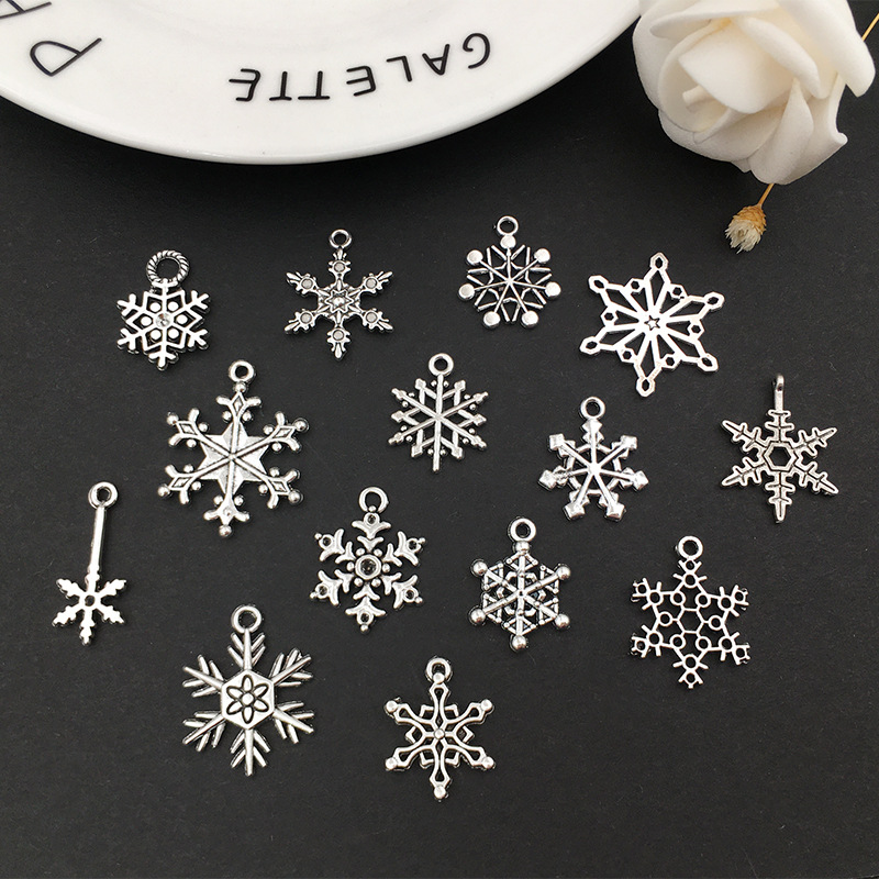 1 copo de nieve aleación colgante DIY aleación joyería brillante plata hueco copo de nieve colgante transfronterizo Amazon Venta caliente