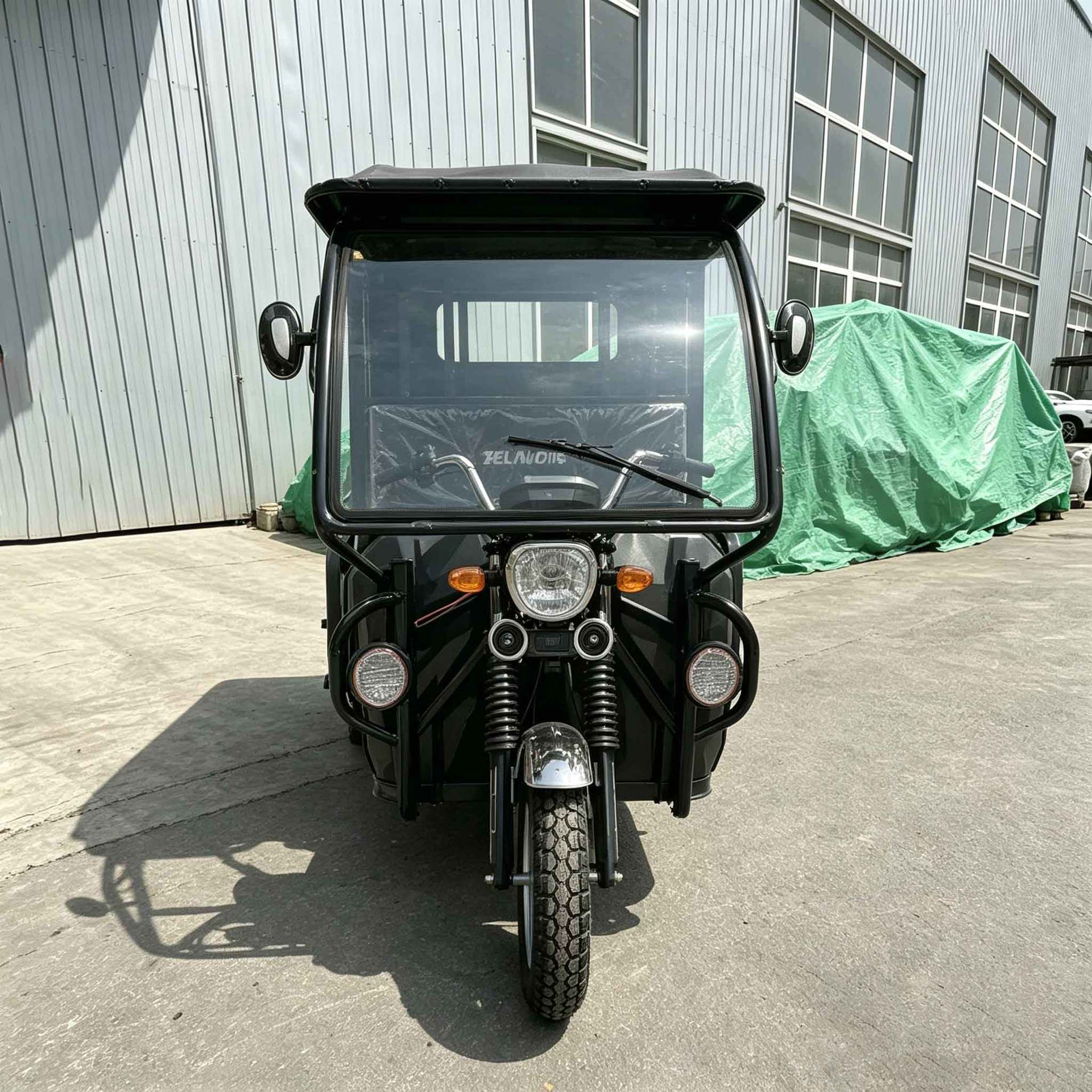 Fueled by a Powerful Engine, the Passenger-Fueled Tricycle with a Canopy Is a Cross-Border Tuktuk for Transporting Passengers and Cargo