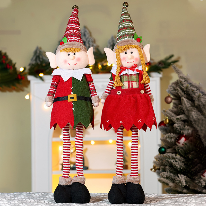 国境を越えた新製品クリスマス伸縮公仔装飾品クリスマス長脚精霊人形が男の子の女の子の人形を飾っている|undefined