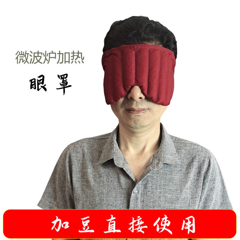 Microwave oven heating eye mask covering temples and applying face to eyes Microwave oven heating eye mask covering temples and applying face to eyes