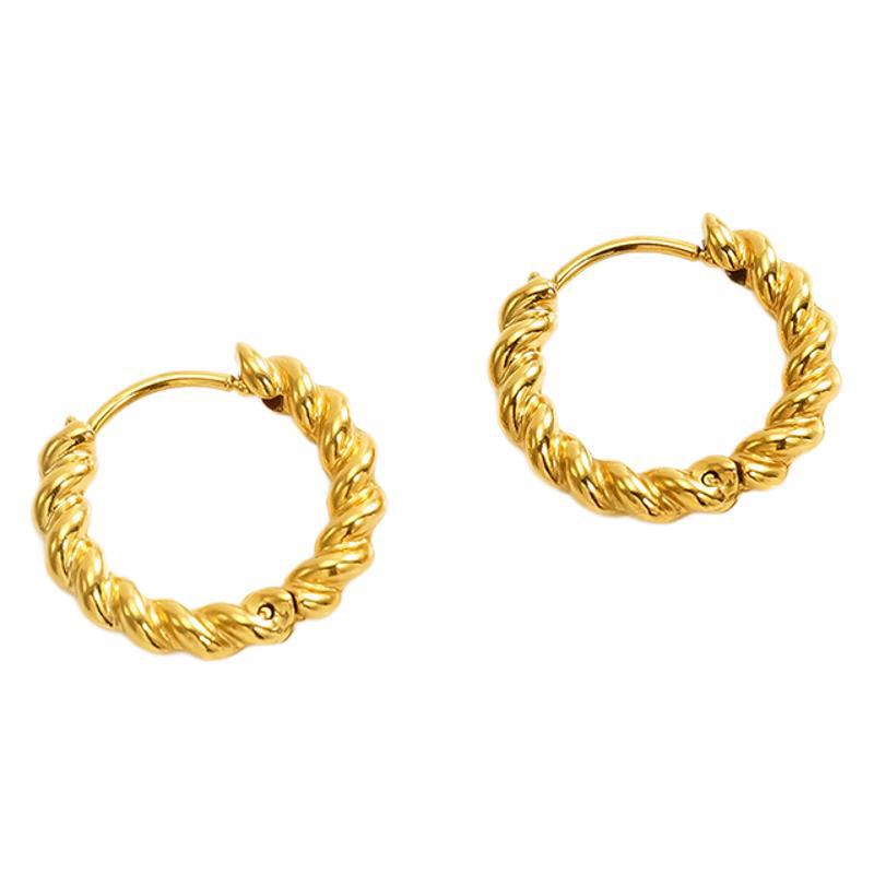 Pendientes chapados en oro de acero inoxidable de nueva moda europea y americana, sentido de diseño minimalista, todo fósforo, exquisito anillo de oreja pequeña de giro de acero de titanio para mujer