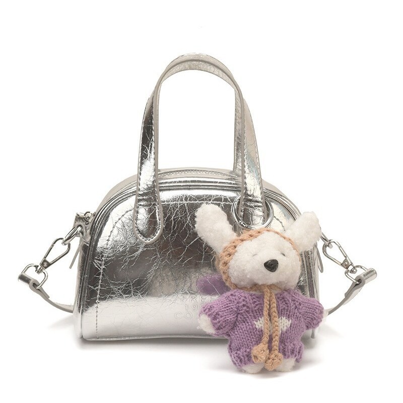 Bolsa de conchas para mujeres 2026 nuevo tipo de bolso de hombro portátil de viaje universal nicho de diseño diario bolso de mano