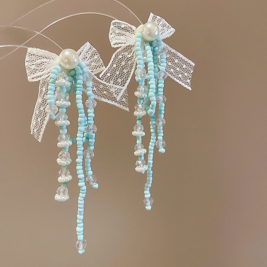 Pendientes de borla de cuentas de arroz de flor de gasa de aguja de plata Pendientes de todo fósforo de estilo de vacaciones Pendientes frescos y dulces para mujer