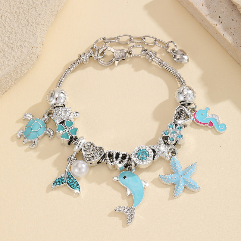 Ocean-themed DIY beaded bracelet with dolphin, starfish, and turtle pendants, adjustable fashion accessory for girls Ocean-themed DIY beaded bracelet with dolphin, starfish, and turtle pendants, adjustable fashion accessory for girls