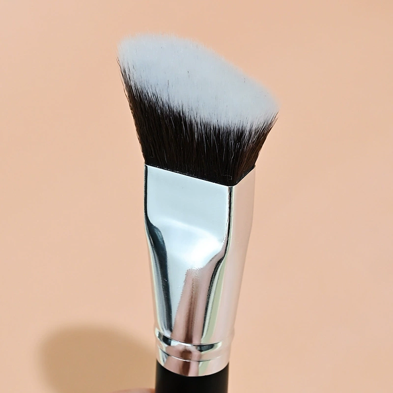 Black foundation, soft face blush for contouring, brush