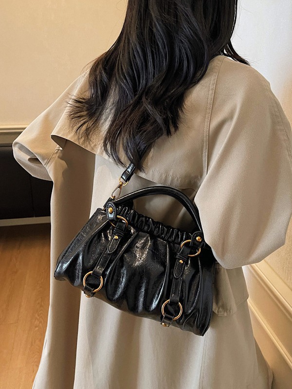 Retro bolso de mano plegable mujer 2025 otoño y invierno nuevo nicho de diseño bolso de cubo de viaje mochila de hombro