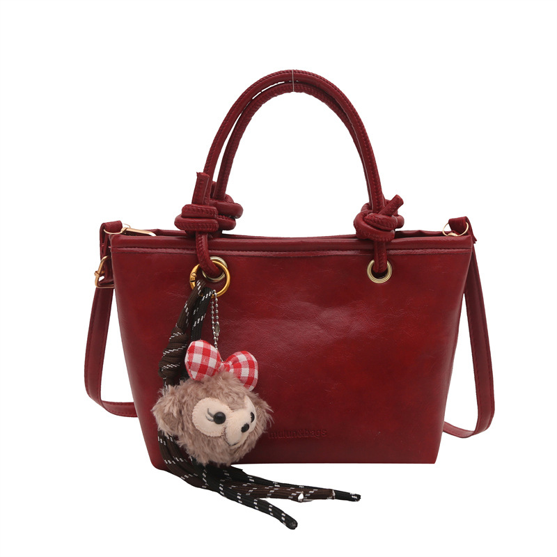 Bolso de moda simple 2024 invierno nuevo estilo retro textura bolso de cubo de moda color sólido viaje mochila de hombro