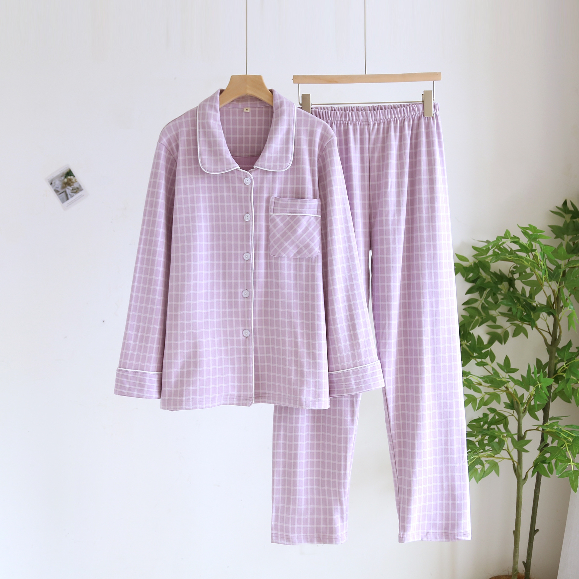 春と秋の冬の新型デコルテのカップルの長袖のズボンの家庭服は簡単でカジュアルな大きいサイズの男性の女性のパジャマのスーツです。