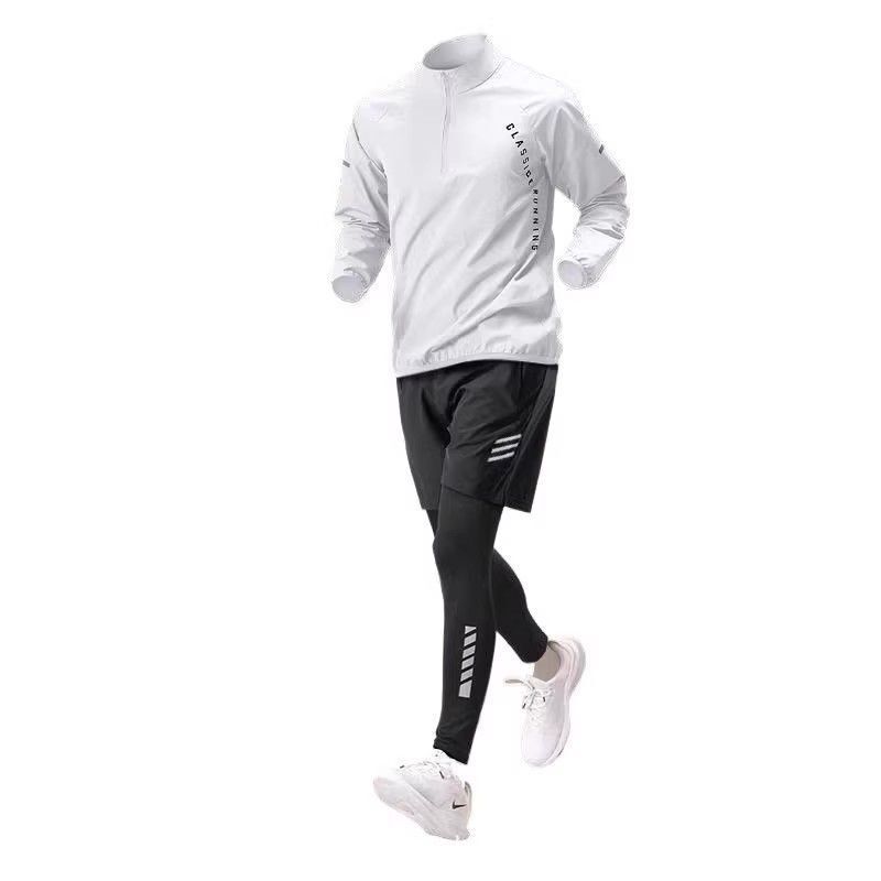 スポーツスーツの男性冬のランニング速乾服は朝のトレーニング服に乗ります。|undefined