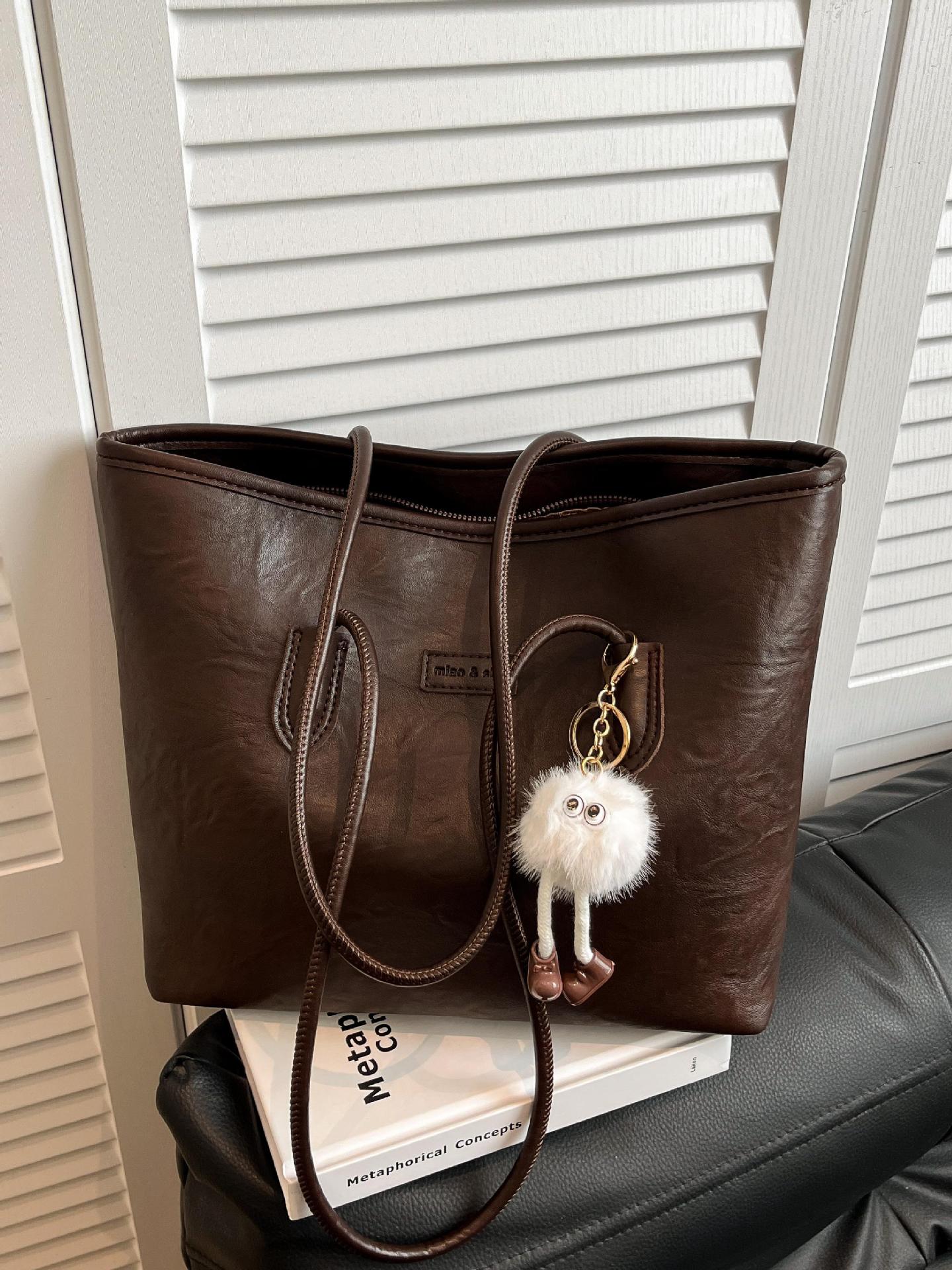 Transfronterizos más vendidos ocio simple bolso de gran capacidad 2025 nuevo producto explosivo bolso de hombro retro bolso de brazo de viaje
