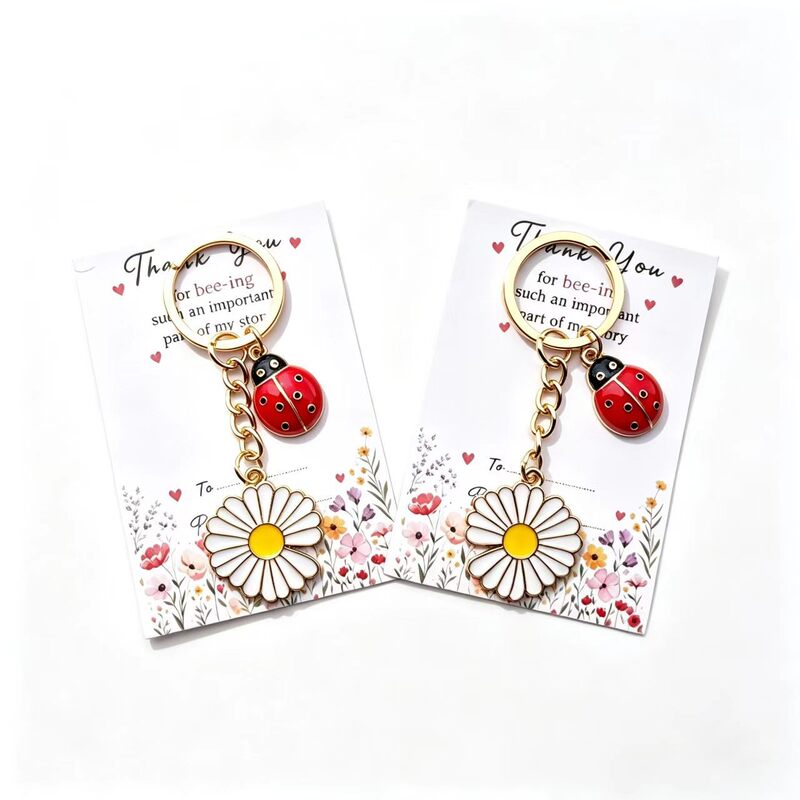 Enamel ladybug and daisy keychain, thank-you card, cute bag charm, wholesale for cross-border sales, perfect as a festive gift Enamel ladybug and daisy keychain, thank-you card, cute bag charm, wholesale for cross-border sales, perfect as a festive gift