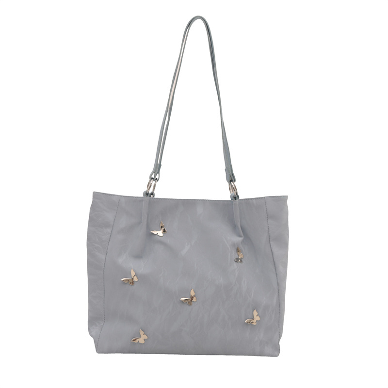 Bolsos de cubo de arco de alta calidad para mujeres 2024 verano nuevo estilo extranjero nicho bolso de hombro de moda bolso de mujer