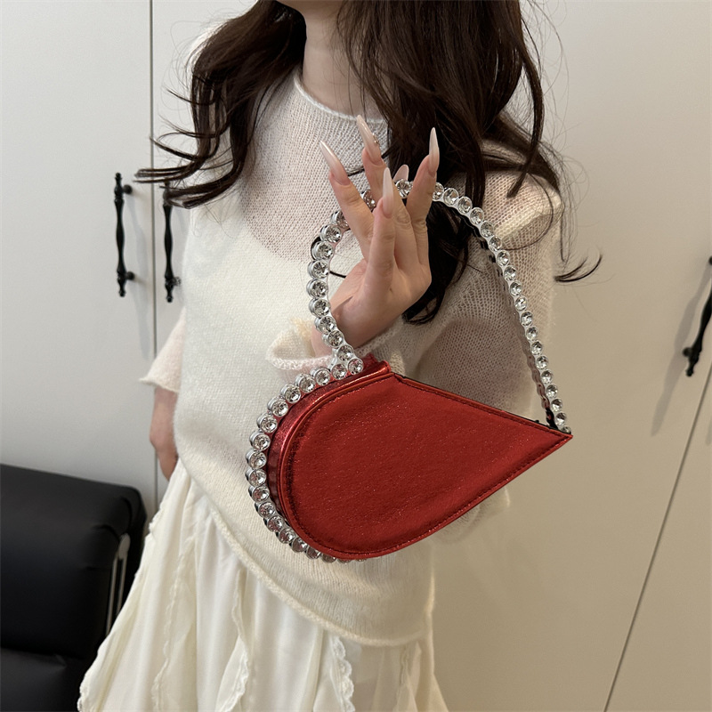 Diseño de nicho, personalidad, forma de amor, moda, estilo occidental 2025, nuevo estilo, estilo occidental, sentido avanzado, bolso de mano, mujer