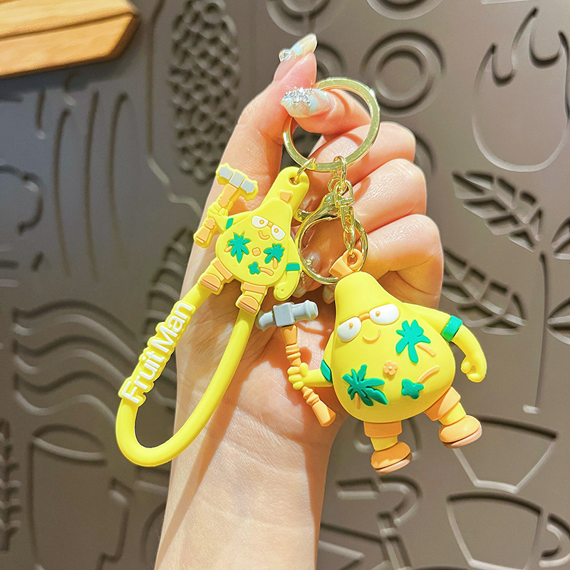 Fruita superhéroes llaveros femeninos lindos dibujos animados Iron Man bolsos de pareja colgante pequeño regalo al por mayor