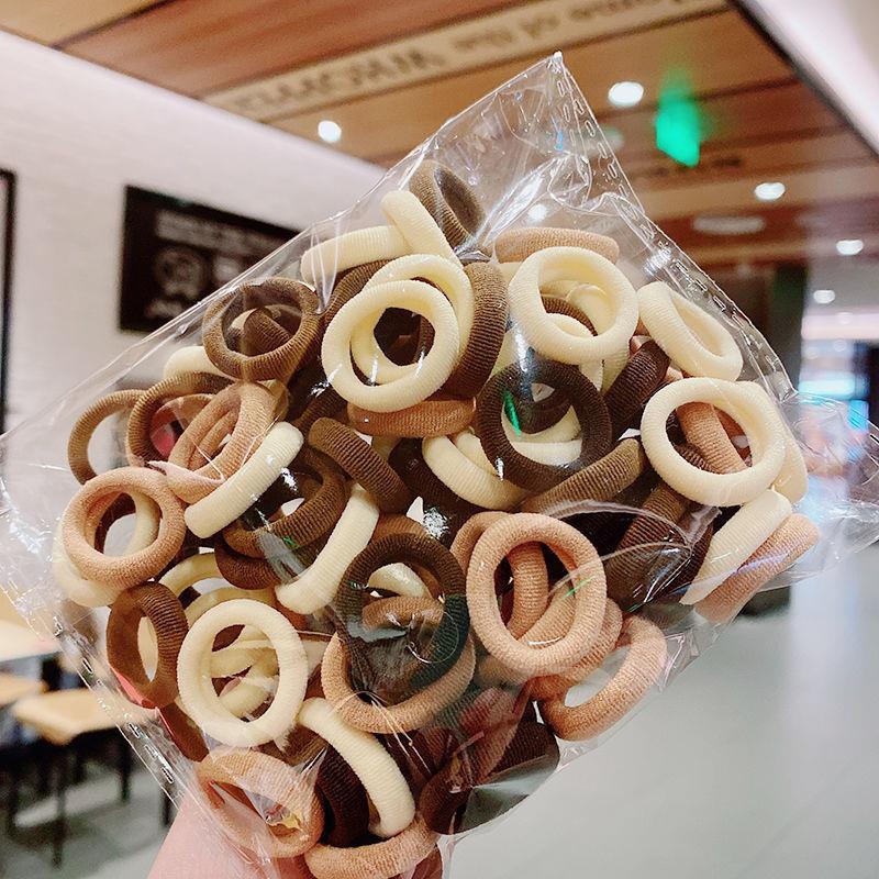 Banda de goma de bebé Corea del Sur banda de pelo de los niños anillo de toalla de color caramelo bolsa de Margarita banda de pelo OPP bolsa cuerda de pelo banda de goma al por mayor