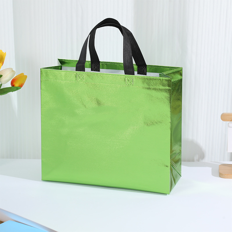 En stock nueva bolsa de regalo no tejida láser bolsa de regalo de boda bolsa de fiesta de comercio exterior logotipo imprimible