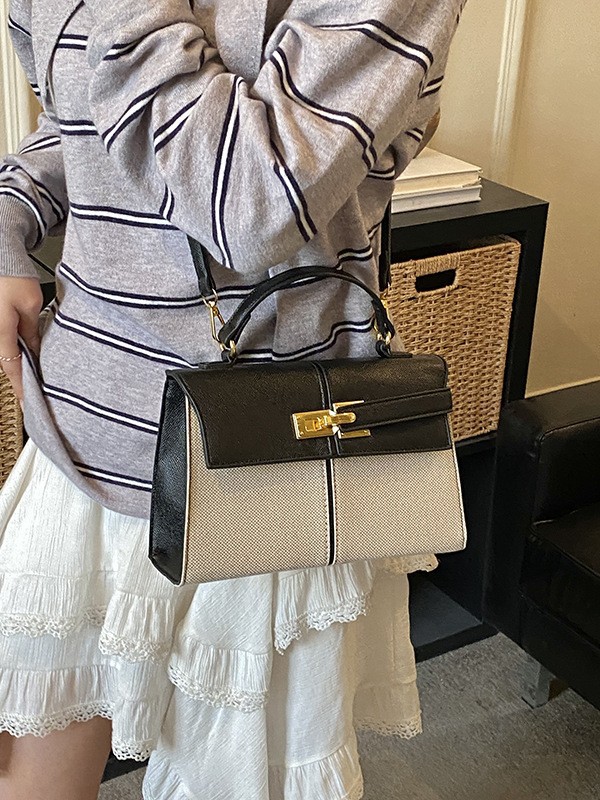 Lujo ligero color contrastante empalme bolso de mano pequeño para mujeres 2026 ventas calientes nueva moda versátil alta sensación mochila