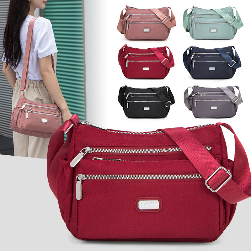 Bolso bandolera de tela Oxford para mujer 20247 nuevo bolso de mujer de mediana edad, bolso de madre de nylon de viaje de gran capacidad, todo fósforo