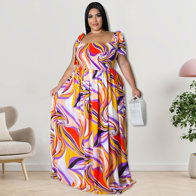 Maxi jurk met spaghettibandjes en smockwerk en strikprint_voghion.com
