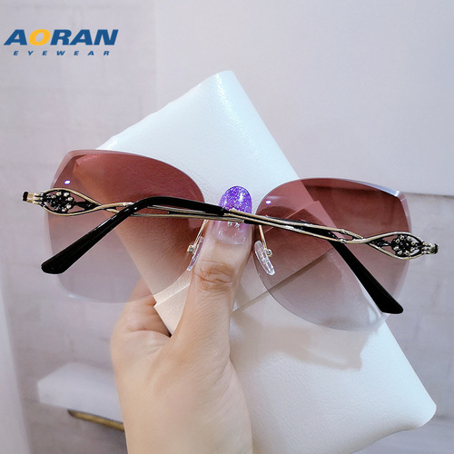 Aoran frameless edge-cut trendy cat-eye sunglasses, personalized metal marine sunglasses, fashion street photography ins glasses