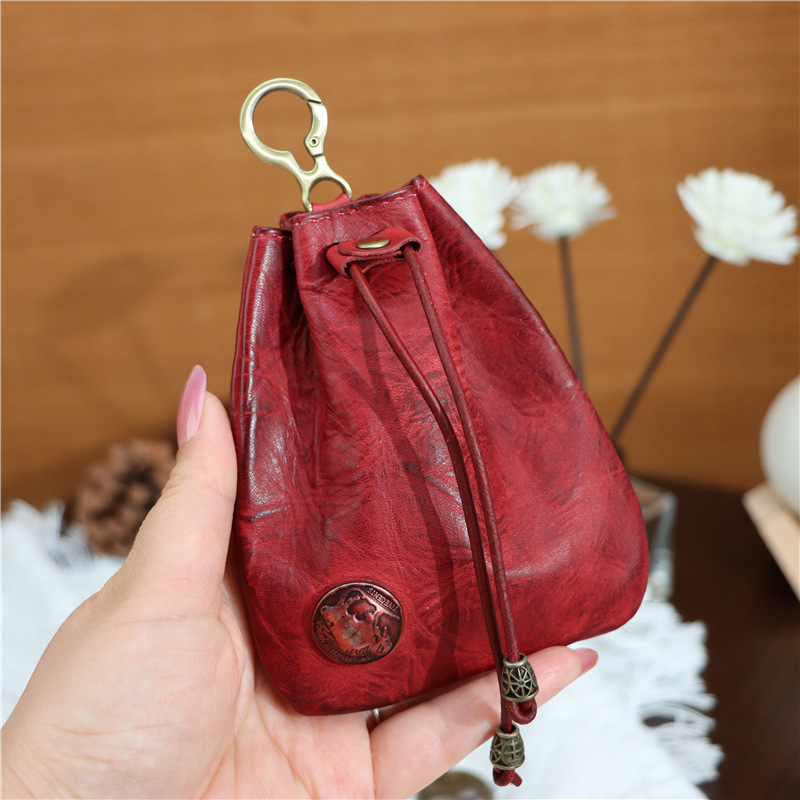 The first layer of cowhide coin purse car key bag lucky bag broken silver bag hanging waist bag men's and women's bundle pocket simple small hanging bag