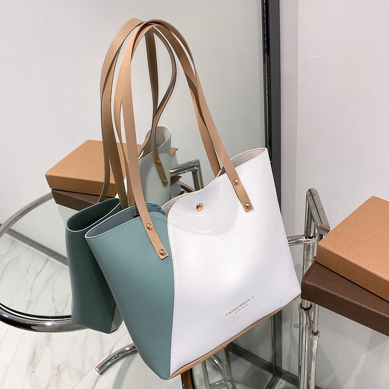 Bolsas de mujer al por mayor de comercio exterior 2023 nueva moda bolsas de hombro de moda personalidad bolsas de tote de color una bolsa transfronteriza