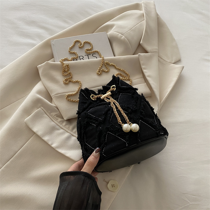 Nicho de diseño bolso de cubo otoño 2024 nuevo bolso de cordón de dibujo bolso de mujer mochila de moda simple bolso de hombro