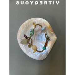 花卉オリジナル玉髄敦煌復古小衆ブレスレット感博物館蘭手は鈴のブレスレットを作っています。