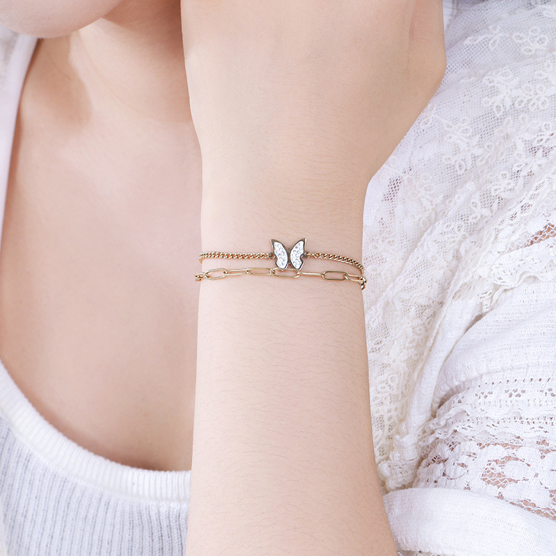 Xuping nueva moda de acero inoxidable chapado 14k nicho de cadena de doble capa de diseño simple pulsera mariposa al por mayor