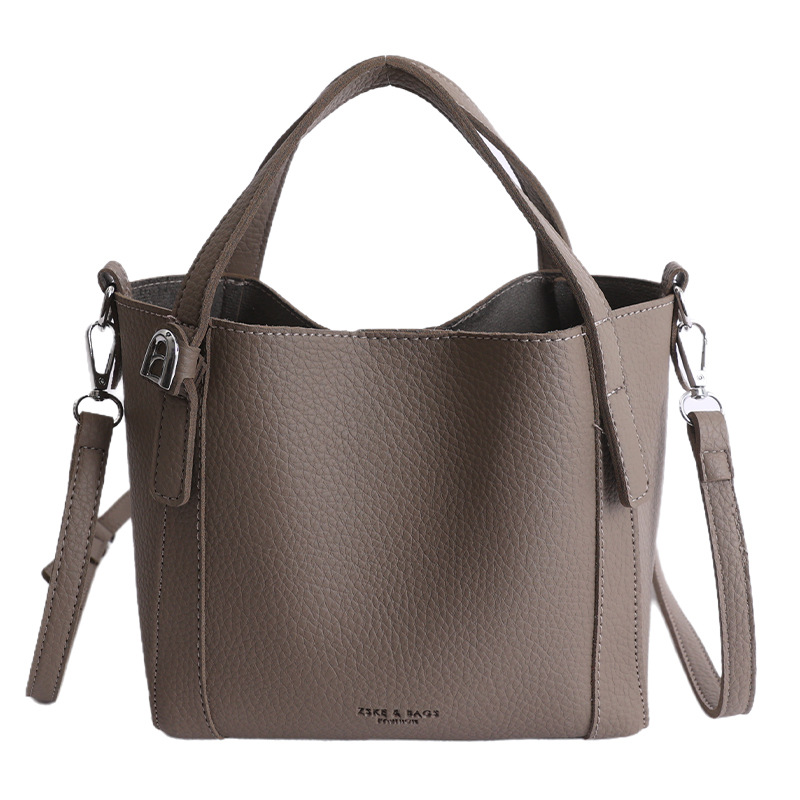 Nicho coreano litchi pattern bolso de cubo de mano mujer comercio exterior nueva moda alta textura ligera lujosa bolsa de mochila