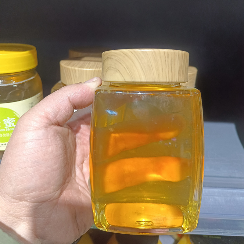 1斤2斤の高級蜂蜜ガラス瓶の四角い厚い木目の蓋ツバメの巣のジャムの食品の包装の瓶の透明な密封|undefined