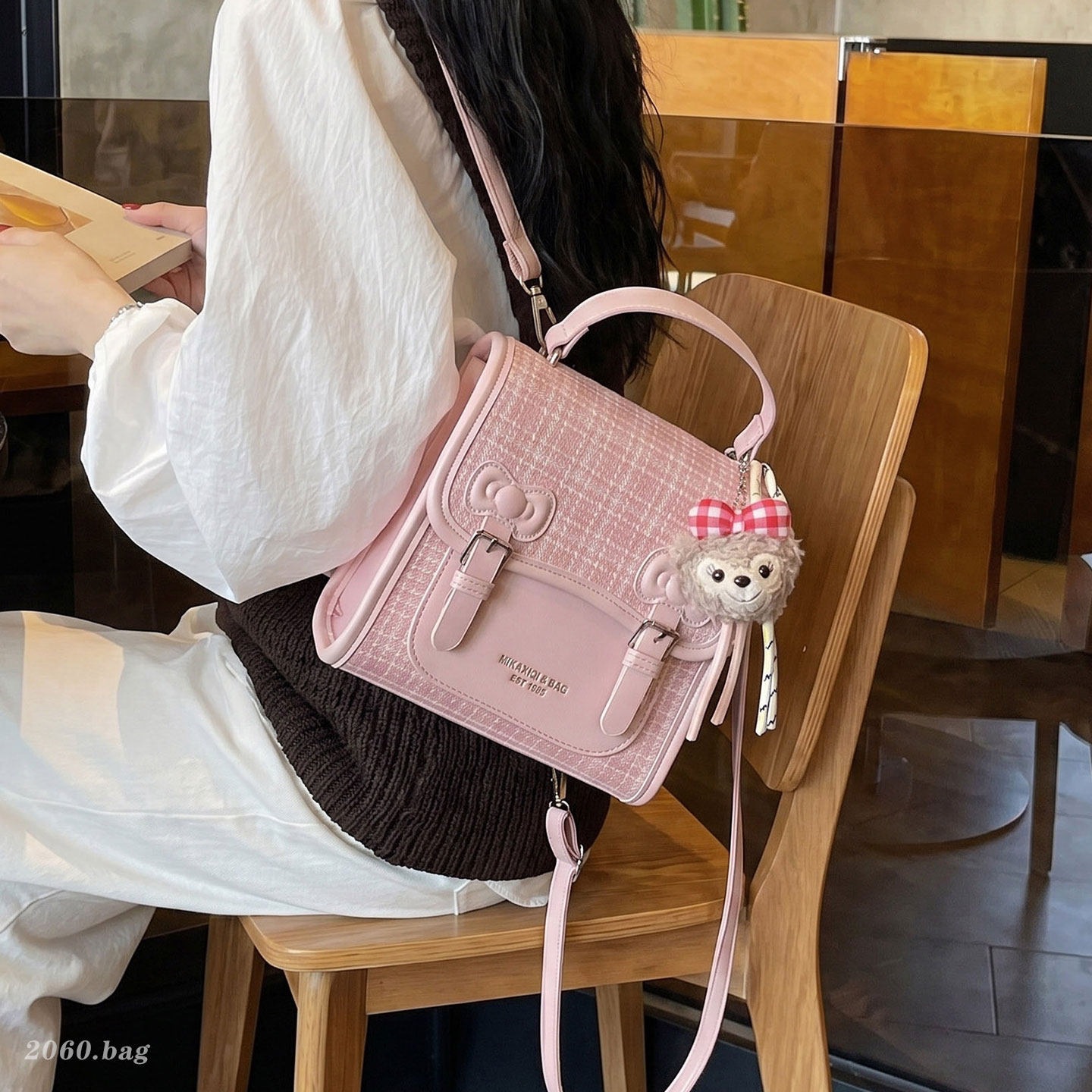 Mochila universitaria popular para estudiantes mochila casual de mujer estilo a cuadrícula nicho 2026 escuela de moda de verano nuevo estilo